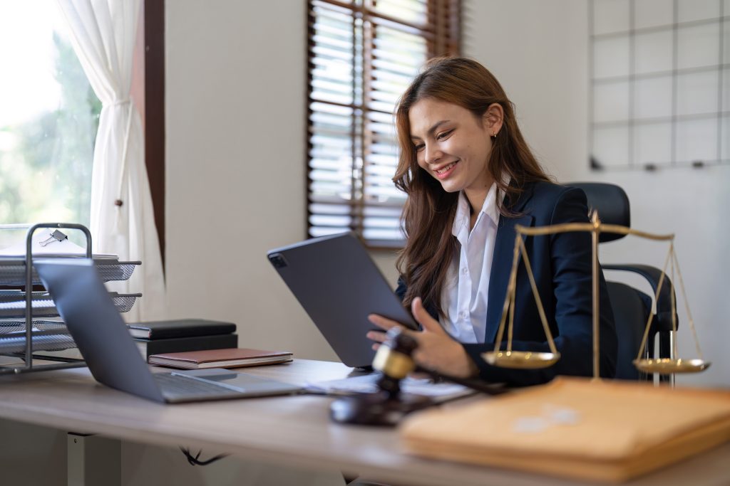 Young lawyer working at desk. Legal Document Verification with TimeBinder.