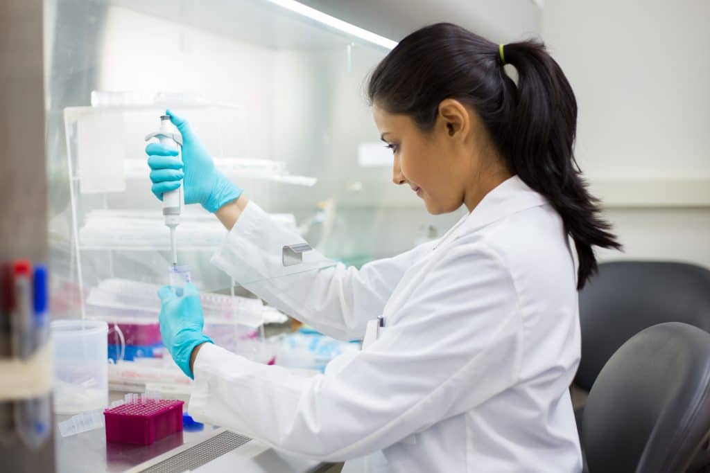 Scientist verifying TimeBinder blockchain Proof of Time Certificate.